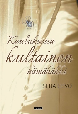 Kauluksessa kultainen hämähäkki